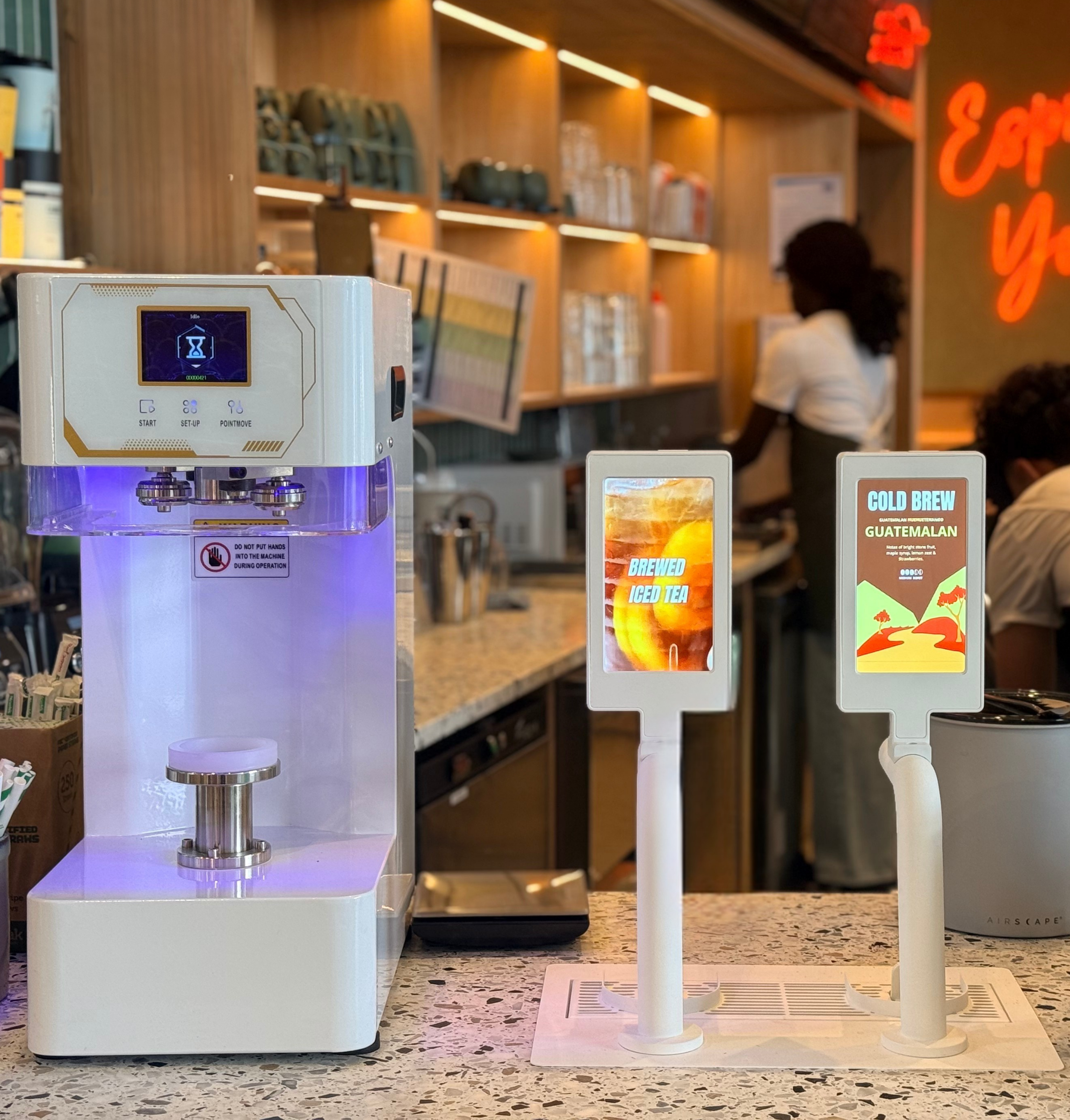 Creative Taps dispensing system with digital screens installed in café - Can-Do Sealer alongside - Creative Canning Solutions Australia