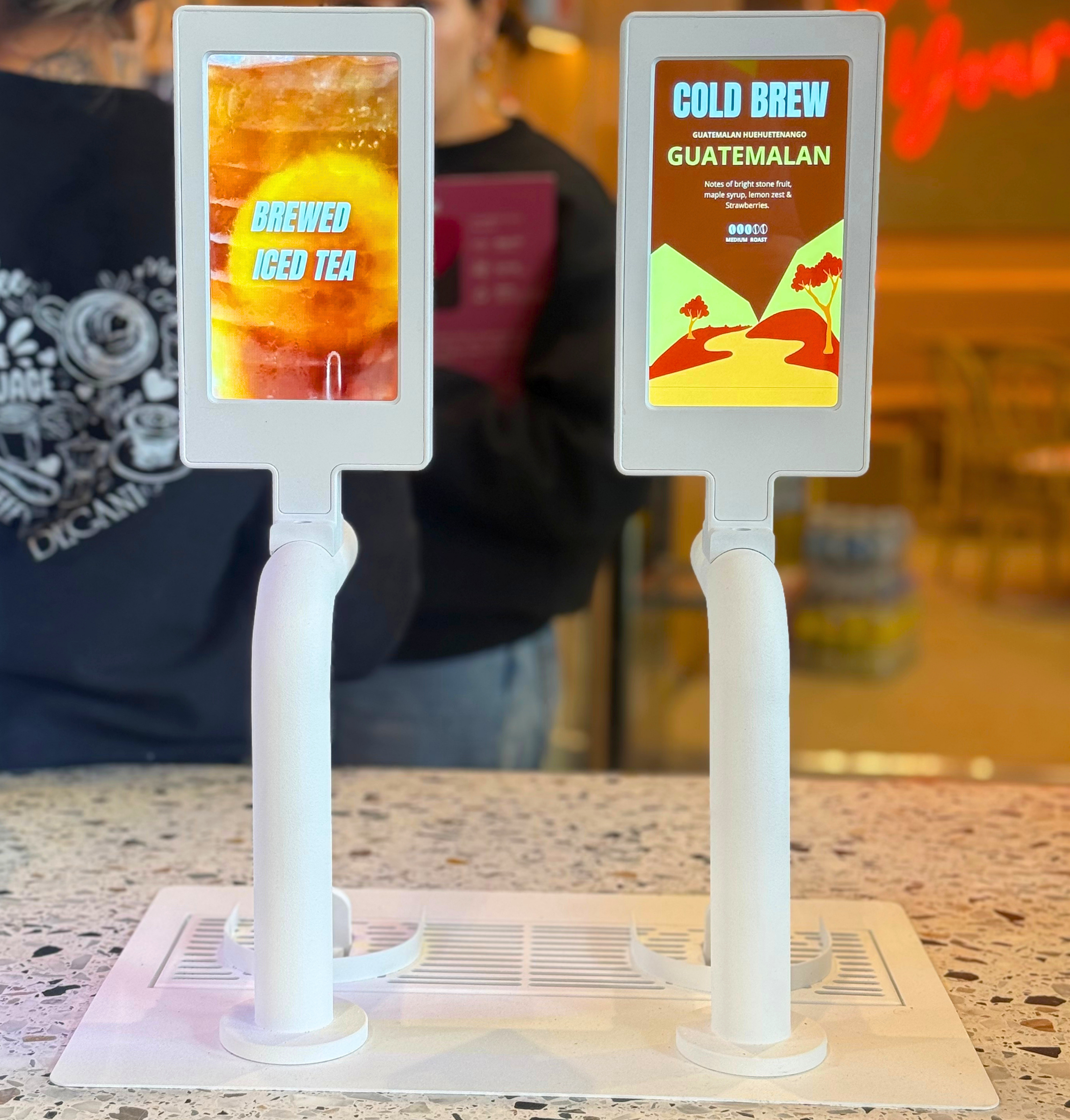 Creative Taps digital menu screens displaying cold brew and iced tea - commercial beverage tap dispenser for cafés Australia